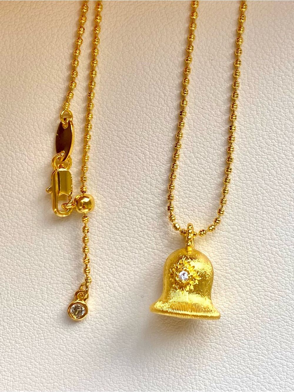 Gold Bell Pendant Necklace with Crystal Accent